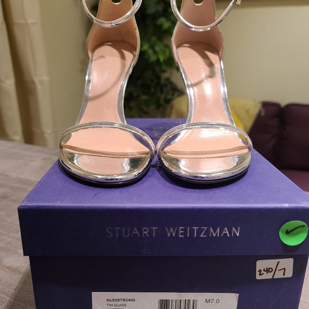 Brand new!!! Stuart Weitzman silver heels. Size 9